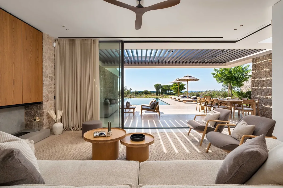 The living room opening onto the pool terrace